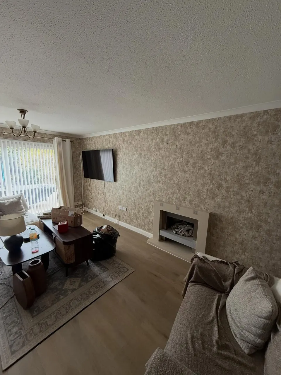 Living room feature walls hung with textured wallpaper