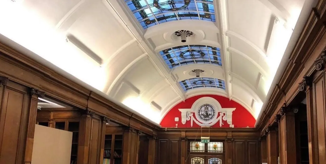 Grand panelled interior with red feature wall decorated by Centurion Decorating
