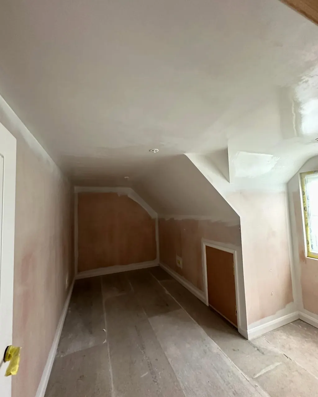 Attic room with new plaster before painting