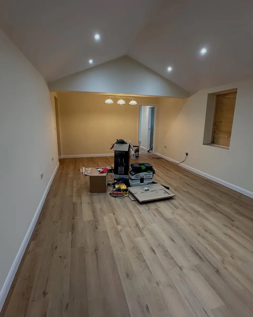 Large room with newly painted pale walls
