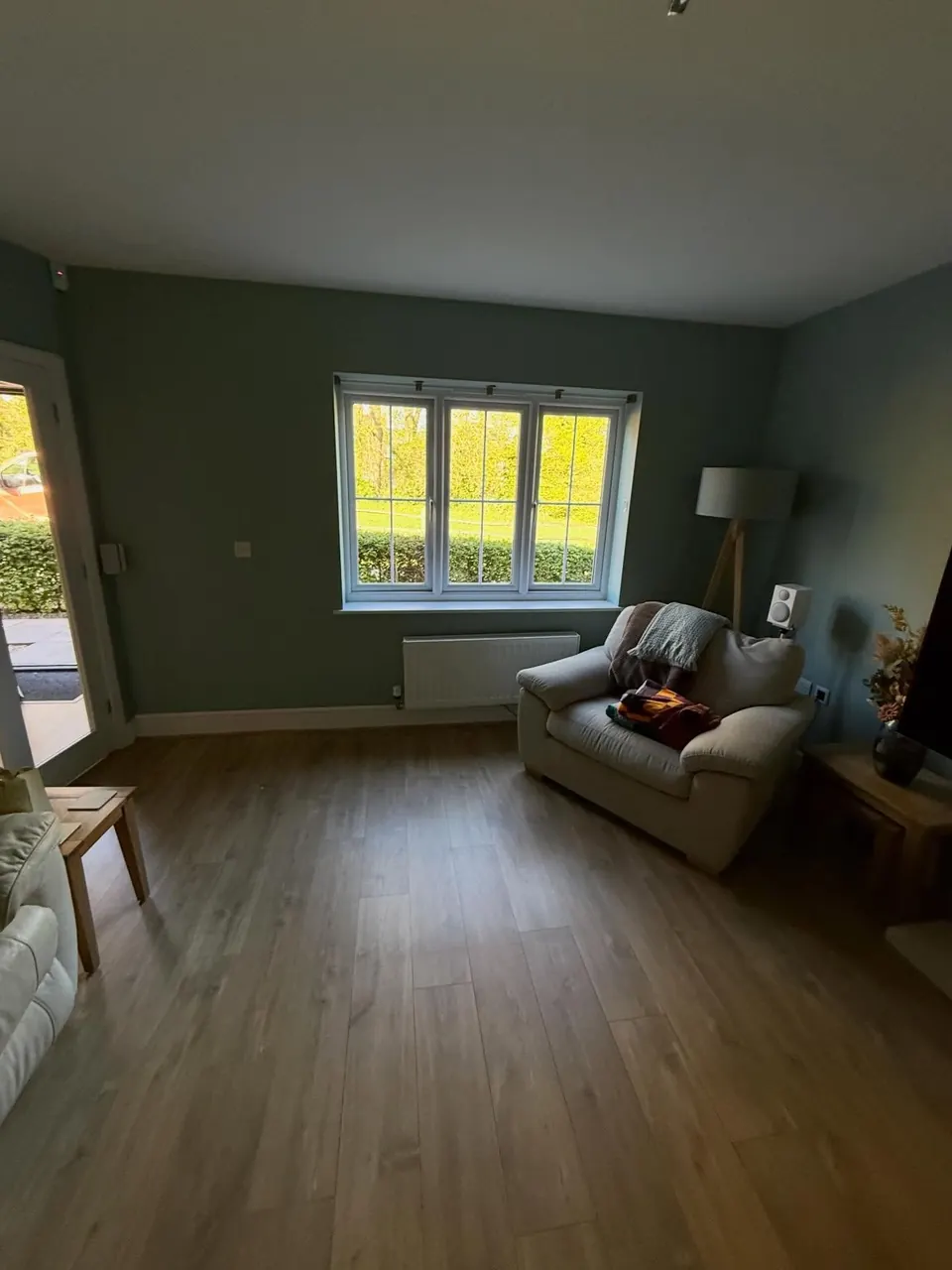 Lounge walls painted in a muted teal green