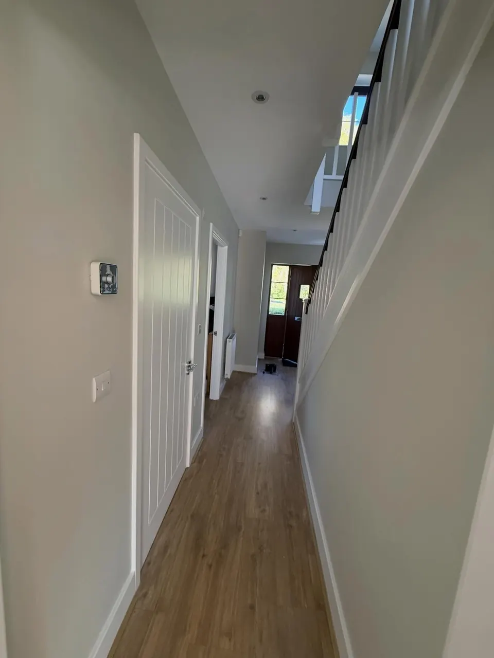 Hallway and staircase painted in a light neutral colour