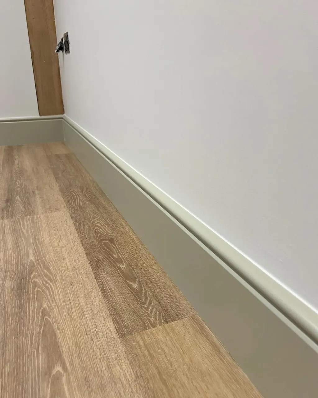 Close-up of a smooth painted skirting board finish