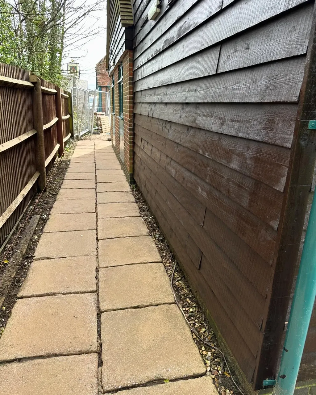 Timber fence and cladding treated in a rich brown finish